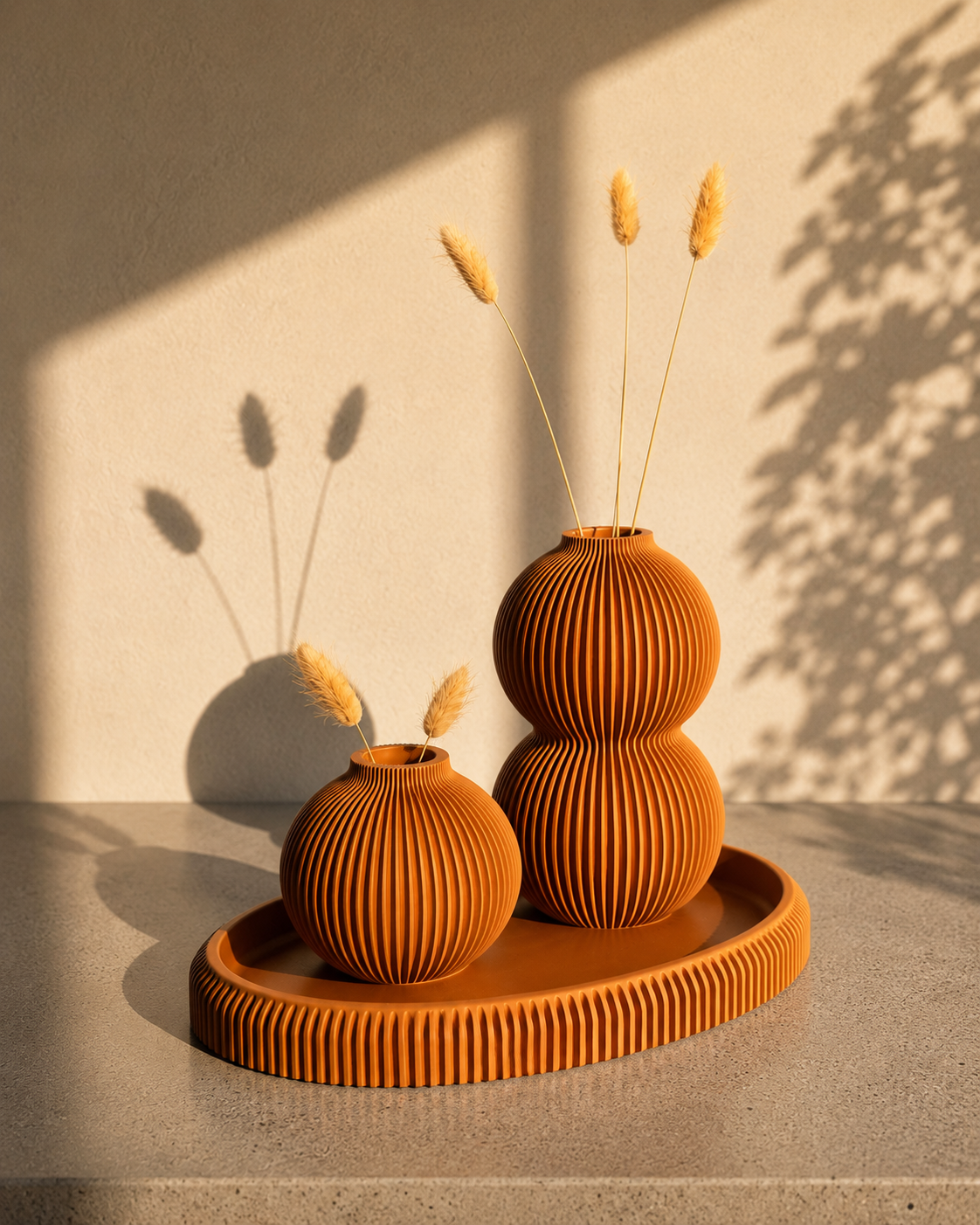 Brown ribbed Orb vases resting on a matching brown tray.